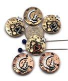 Bring a magical touch to your jewelry with these celestial cat two‑hole beads. Accented with heart, star, and moon motifs, these round mixed‑metal beads in copper, silver, and brass finishes add artisan beauty to boho bracelets, spiritual necklaces, or pendants. Their dual‑hole design ensures stability for multi‑strand projects. Perfect for creating unique gifts for cat lovers and stargazers alike.
