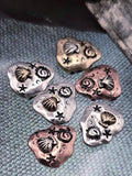 Bring the beauty of the beach to your creations with these seashell slider beads. Each bead features a raised shell, swirling ocean motifs, and star accents on pebble‑shaped bases in copper, silver, and brass finishes. Perfect as focal beads for bracelets or pendants, their dual holes align them securely. Ideal artisan supplies for boho, nautical, or summer jewelry collections.