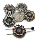 These sunflower 2‑hole slider beads bring rustic elegance to jewelry design. Available in antique silver, brass, and copper finishes, the non‑tarnish coating ensures long‑lasting shine. Their bold, detailed petals and textured center make them perfect as pendants or focal beads in necklaces and chokers. Durable, artisan‑style components ideal for statement jewelry or handmade bohemian pieces celebrating nature’s charm.