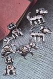 Bring playful charm to your jewelry with these dog 2‑hole slider beads. Each bead features an adorable pup design with raised details, accented with tiny hearts and bones for extra character. Finished in silver with copper highlights, they’re durable and easy to align using the dual holes. Perfect as focal beads in bracelets or pendants, ideal for pet‑themed artisan jewelry.