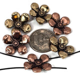 Bring a touch of nature to your designs with these 2 hole flower slider beads in warm copper and antique gold finishes. Each bead has five rounded petals with a textured center, offering charm and elegance for handcrafted jewelry. Their two‑hole slider structure keeps them secure and flat in jewelry projects, making them great for multi‑strand bracelets, boho necklaces, or pendants. Lightweight yet durable, they’re essential floral findings for artisans and DIY jewelry makers.