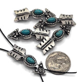 These turquoise arrow slider beads capture Western spirit with engraved arrow details and a vibrant oval centerpiece. Finished in textured antique silver, each bead is crafted with two stringing holes for stability and balance in jewelry. Perfect as focal beads in chokers, pendants, or bracelets, they also make great spacers for layered designs. Ideal for artisans and DIY creators designing boho, tribal, or Southwestern jewelry projects.