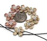 These copper and gold 2 hole flower beads are crafted with hammered-style petals and silver accented centers. Perfect as focal beads or spacers, they bring natural inspiration to jewelry projects. Their two-hole slider build keeps designs sturdy and professional, making them an artisan favorite for floral bracelets, boho necklaces, and romantic chokers.