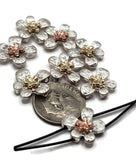 Create floral-inspired jewelry with these 2 hole slider beads in antique silver, accented by copper and gold flower centers. The hammered look adds rustic charm while the two-hole format keeps designs structured and professional. Great for bracelets, pendants, and chokers, these beads work beautifully as statement focals in bohemian or garden-inspired handmade jewelry.