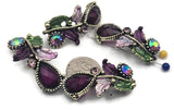 Make your designs unforgettable with plum resin and crystal 2‑hole focal beads. Antique metal settings curve into vines, dotted with enamel leaves in lavender and green. Two holes hold the component steady for bracelets, chokers, and pendant bars. Perfect for boutique statement pieces and giftable, romantic jewelry.