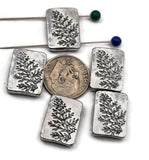 Nature‑inspired 2 hole slider beads with etched botanical sprigs on bright antique‑silver rectangles. The dual holes are small—best for fine stringing like beading wire (0.015–0.018&quot;), FireLine/Power Pro, nylon thread, or micro cord up to ~0.8 mm. Not for leather or chain. Perfect as focal sliders for delicate bracelets, chokers, pendants, earrings, and rings. Non‑tarnish finish. Set of 5 matching beads.