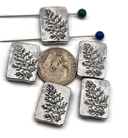 Nature‑inspired 2 hole slider beads with etched botanical sprigs on bright antique‑silver rectangles. The dual holes are small—best for fine stringing like beading wire (0.015–0.018&quot;), FireLine/Power Pro, nylon thread, or micro cord up to ~0.8 mm. Not for leather or chain. Perfect as focal sliders for delicate bracelets, chokers, pendants, earrings, and rings. Non‑tarnish finish. Set of 5 matching beads.