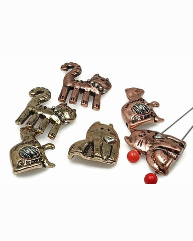 Celebrate feline style with these cat-themed 2-hole slider beads in rustic copper and bronze tones. Featuring adorable designs with hearts, yarn textures, and collars, they make perfect accents for whimsical boho jewelry. The two-hole structure provides durability and balance in bracelets, chokers, and multi-strand necklaces. A wonderful choice for cat lover gifts, artisan festival jewelry, or symbolic animal-themed accessories.