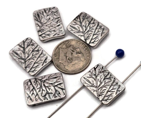Silver metal 2 hole slider beads with etched tree branch design. Rectangular artisan beads that sit flat as focal beads in bracelets and chokers. Small, parallel holes fit fine beading wire, FireLine, Power Pro, or micro cord up to ~0.8 mm; not for leather. Lightweight, tarnish‑resistant finish. Set of 5 nature beads for woodland, cottagecore, and minimalist jewelry making.