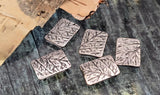 These botanical rectangle beads feature a detailed twig/branch motif in antique silver. Use as focal beads or structured spacers in delicate bracelets, pendant necklaces, and earrings. Two small holes keep strands aligned for a professional look—ideal for seed bead projects and thin cord. Durable, non‑tarnish artisan findings. Pack of five silver 2‑hole sliders.