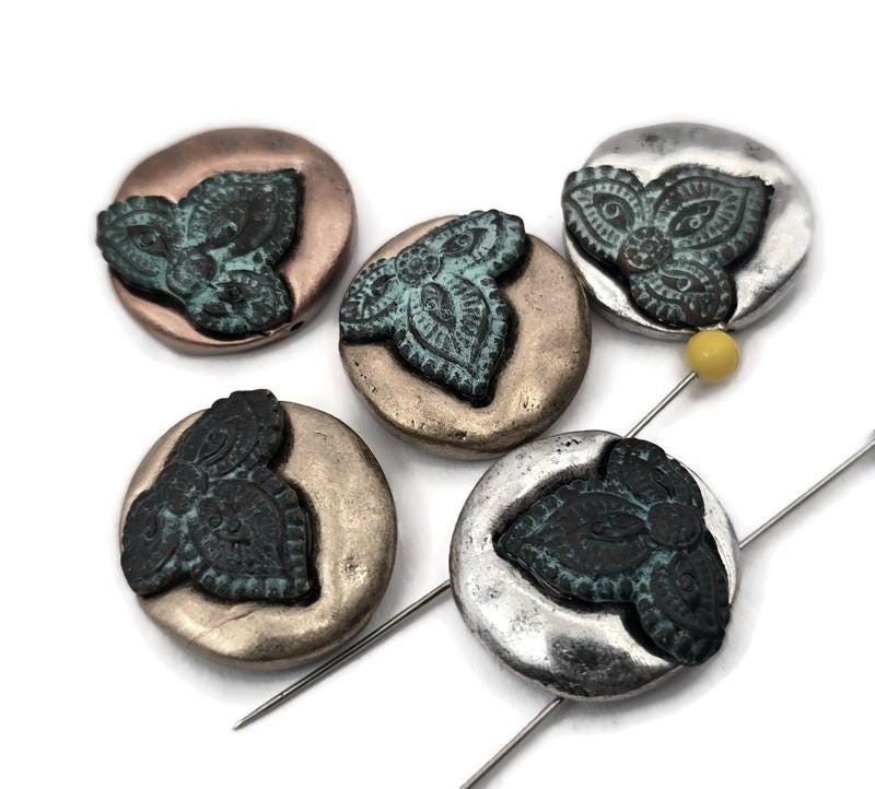 Create polished, professional jewelry with two‑hole slider beads designed for double strands. Their side‑by‑side holes keep patterns aligned in bracelets and necklaces, yet you can choose only one set when preferred. Durable metal adds a modern artisan touch to earrings, rings, and craft décor—from zipper pulls to candles. Because these unusual components are rarely stocked elsewhere, our shop curates them for makers who want distinctive results.