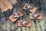 Craft desert‑inspired designs with metal cactus two‑hole sliders. Dual holes on each side support double‑strand stringing, structured layouts, and clean transitions between beads. Use them with leather, beading wire, or ribbon; choose both holes or one set to fit your plan. Perfect for jewelry, zipper pulls, and decorative crafts. These unusual findings are a hallmark of our unique bead shop assortment.