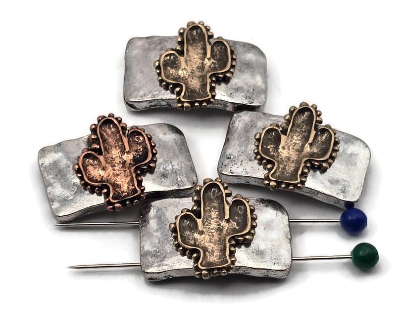 Add Western character to your designs with cactus two‑hole slider beads. Dual holes on each side keep double‑strand bracelets and necklaces aligned, or use a single set for flexible layouts. The textured metal rectangle and cactus focal pair beautifully with leather, cord, gemstones, and glass. Great for earrings, rings, zipper pulls, and décor accents. Hard to find in stores—curated for makers who love unique components.