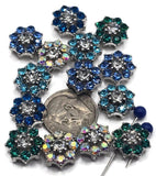 These floral rhinestone slider beads are perfect for festival, bridal, or statement jewelry. Crafted from dazzling aqua, blue, emerald green, and AB rhinestones set into a silver-tone base, they shimmer beautifully under any light. The 2-hole slider design keeps strands aligned and secure, making them ideal for artisan bracelets, chokers, or layered necklaces. Great for bold boho styles and handmade accessories.