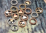 Unique beads that sell themselves—round heart 2 hole slider beads with a twisted rope frame and layered hearts. Mixed silver, copper, and gold tones offer ready‑made styling options. These metal beads are lead and nickel free with a protective finish designed to stay bright. A standout metal finding for statement bracelets, minimalist pendants, and curated giftable sets.