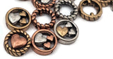 Craft sentimental bestsellers with these heart beads. Each circular slider has a rope‑edge ring and dimensional hearts inside, delivering a polished focal without extra effort. Two holes give a clean, aligned presentation. Premium metal findings with long‑lasting, anti‑tarnish shine; hypoallergenic construction. Mixed‑metal finishes add warmth and depth, making these unique beads ideal for artisan, boutique‑style jewelry collections.