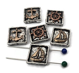 Coastal classics in mixed metals. These nautical sliders present raised ship wheels, anchors, and sailboats inside chunky square frames. The antiqued finish settles into textures while bronze accents shine on high points. Use as focal beads to anchor bracelet designs or as pendants on necklaces. Their rugged edges and maritime icons add bold personality and collectible charm.