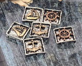 Weathered‑edge nautical slider beads combining antique silver with warm bronze details. Choose from anchor, ship wheel, and sailboat motifs to build a cohesive coastal story. Two-hole construction offers a neat, centered presentation. Great as focal beads in bracelets and as pendant accents on necklaces. Unique beads and quality metal findings with purposeful patina for depth and dimension.