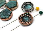 Statement-ready lotus sliders with a weathered turquoise finish over a raised floral pattern. The round shape and mixed-metal settings—silver, copper, brass—create a versatile focal. Excellent as focal beads in bracelet strands or as a pendant element on necklaces. These unique beads and premium metal findings add an artisan, nature-inspired touch to any jewelry project.