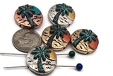 Coastal sunset palm beads for jewelry making. Two-hole sliders with raised palm tree and waves; antique silver, copper, and brass tones with verdigris accents. Ideal focal beads for bracelets and charm necklaces. SEO phrases: tropical bead, beach jewelry supplies, island palm bead, round coin bead, mixed metal beads, seaside beads.