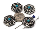 Antique silver concho beads with turquoise center cabochon. These 2 hole slider beads feature a scalloped square concho shape with deep floral stamping and dotted bezel. Ideal focal beads for bracelet designs and pendant centers on necklaces. Keywords: turquoise concho bead, western jewelry supplies, silver concho slider, boho southwestern bead, metal focal bead, 2 hole bead.