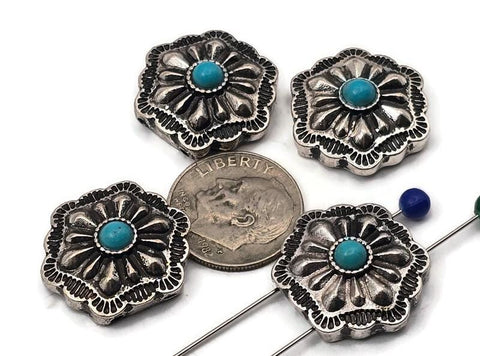 Antique silver concho beads with turquoise center cabochon. These 2 hole slider beads feature a scalloped square concho shape with deep floral stamping and dotted bezel. Ideal focal beads for bracelet designs and pendant centers on necklaces. Keywords: turquoise concho bead, western jewelry supplies, silver concho slider, boho southwestern bead, metal focal bead, 2 hole bead.