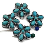 Boho western turquoise flower sliders with antique silver bead‑edged petals. Six cabochons radiate around a button center, giving dimensional shine and a smooth profile. These 2 hole slider beads deliver a standout focal bead for bracelets, necklaces, and rings. Great for cowgirl, ranch, and desert‑inspired jewelry collections.