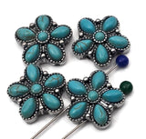 Southwest turquoise floral beads, two‑hole sliders with beaded borders and six teardrop petals around a center cab. The oxidized silver finish adds depth and contrast, letting the turquoise blue glow. A dependable focal bead that suits bracelets, pendant necklaces, statement earrings, zipper pulls, and decorative craft accents with boho charm.