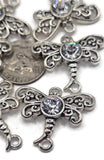 Add natural charm to your beading with these dragonfly connector findings. Designed with antique silver filigree wings and a shimmering rhinestone at the center, these connectors feature loops at each end for versatility. Use them in bracelets, chokers, necklaces, or layered jewelry projects. Great for bohemian jewelry, sparkling artisan gifts, or whimsical accessories celebrating transformation and freedom.