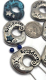 These donut‑shaped Wisdom slider beads elevate everyday designs. Crafted in antique silver with verdigris detailing and rhinestone sparkle, they bring calm, meaningful energy to bracelets and necklaces. Ideal as focal slider beads, strand separators, and decorative spacers in bohemian and yoga jewelry.