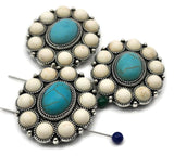 Statement concho flower 2‑hole beads, antique silver with faux turquoise and ivory cabochons. Round metal focal beads for bracelets necklaces. Small‑hole double‑strand channels suit fine beading wire; avoid leather. Perfect for boho jewelry, rodeo outfits, and festival looks. Buy bulk wholesale metal components and unique spacer/filler DIY parts.