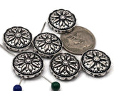 Round mandala 2‑hole sliders in bright antique silver. Crisp flower engraving, dotted border, and airy side cutouts give artisan charm. Small‑hole channels suit fine beading wire and braided thread; avoid leather. Great focal connectors and spacers for layered chokers, bracelet stacks, and pendant bars. Essential jewelry making supplies and wholesale components.