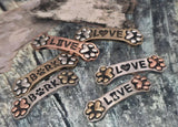 Mixed‑metal dog bone 2‑hole sliders—silver, bronze, copper. Paw print ends, LOVE with heart or bone, BARK with paw. Double‑strand slide spacers for beaded bracelets and chokers. Pet lover jewelry supplies, components parts, unique spacer filler DIY, wholesale metal findings, cheap sliderbeads, dog mom bracelet focal.