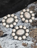 Craft meaningful jewelry with these unique oval two-hole beads. Showcasing a striking white cabochon center surrounded by delicate cabochons, these large antique silver sliders make excellent statement focals. The dual-hole design keeps your projects structured, especially in chokers or stacked bracelets. Their bold yet versatile appeal makes them suitable for bohemian, Western, spiritual, or artisan-style handmade jewelry designs.