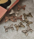 Bring bohemian elegance to your handmade jewelry with these antique butterfly two‑hole sliders. Each bead is designed with lacy wing cutouts and comes in rich copper, weathered brass, and silver finishes. Their dual holes add structure and keep beads aligned in bracelets or necklaces. Use them as focal links or connectors for artisan‑style jewelry celebrating transformation and natural beauty.
