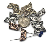 These textured 2‑hole beads bring handcrafted character to everyday jewelry. The arc profile hugs the wrist; oxidized details pop against silver, copper, and gold tones. Use as a single centerpiece or line up several for a dramatic necklace bar. Excellent components for bohemian and rustic designs.