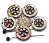 Round paw print 2‑hole slider beads in mixed metals—antique silver, copper, and brass. A raised paw sits inside a donut frame with tiny paw accents. Double‑strand layout with small parallel holes keeps thin strands aligned and flat. Perfect focal beads for dog mom bracelets, pet memorial jewelry, adoption fundraiser gifts, and animal‑lover chokers. Best with fine beading wire, FireLine, or micro cord.