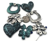 This mixed set features dimensional clover sliders, an open clover link, and a verdigris heart. Build bracelet focal designs, pendant bar necklaces, and layered chokers. The textured finish photographs beautifully for Etsy listings and craft‑fair displays. Pair with jasper, crystal spacers, or wood heishi for rustic, nature‑inspired jewelry with a little Irish luck.
