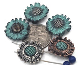 These sunflower sliders add instant sunshine to double‑strand bracelets. The scalloped petals and oxidized shadows pop in photos, while the teal wash brings fresh color. Use as focal slider beads, strand separators, or structured spacers in bead‑loom cuffs. Ideal for spring collections, bridesmaid gifts, and farmer’s market jewelry.
