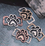 Design heartfelt jewelry with these paw print slider beads. Each bead features a raised paw motif set in antique silver, copper, or gold finishes, framed by a sturdy rectangle design. With dual side holes, they stay aligned in bracelets, chokers, or necklace projects. Perfect for pet lover accessories, animal‑inspired designs, or commemorative handmade jewelry with symbolic meaning.