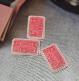 Coastal chic made simple: rectangular seashell/starfish 2 hole sliders in bright silver with a coral‑pink design. Center one bead and build slim seed‑bead bands to each side, or use it as a pendant connector with chain. Mix with sea‑glass greens, aqua crystals, and freshwater pearls for a beach‑bride look. Practical jewelry making supplies, metal beads, and spacer/connector components for DIY makers.