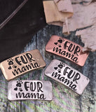 These rustic “Fur Mama” two‑hole slider beads highlight your love for pets in every piece of jewelry. Designed with paw prints and bold raised lettering, they’re available in silver, copper, and antique brass finishes. Dual alignment holes allow for professional placement in bracelets, chokers, or necklaces. Perfect artisan focal beads for memorial jewelry, pet lover gifts, or animal‑themed handmade designs.