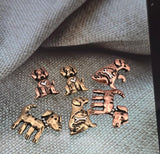 Celebrate pets with these adorable dog beads, crafted in antique brass and copper finishes. Each bead features detailed accents including hearts and bones, making them perfect for symbolic jewelry. Lightweight with side holes for stringing, they work beautifully in bracelets, necklaces, or earrings. Ideal for artisan gifts, pet memorial jewelry, or handmade designs for animal lovers and dog enthusiasts.