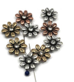 These inspirational daisy flower two‑hole slider beads combine function and meaning. Engraved with words like Hope and Faith, accented with rhinestone centers, they’re available in antique silver, copper, and brass finishes. Their double side holes hold them firmly in multi‑strand bracelets, chokers, or necklaces. Perfect for artisan jewelry, spiritual gifts, or handmade accessories meant to uplift and inspire.