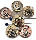 These celestial cat two‑hole slider beads feature charming designs of cats sitting on crescent moons or cuddling under stars with heart motifs. Finished in mixed antique tones of copper, brass, and silver, they’re ideal as focal beads for artisan bracelets and pendants. Perfect for celestial jewelry, pet lover gifts, or handmade keepsakes that combine mystical themes with meaningful animal symbolism.