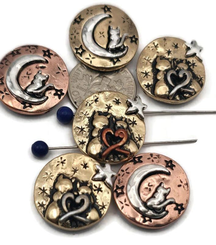 These celestial cat two‑hole slider beads feature charming designs of cats sitting on crescent moons or cuddling under stars with heart motifs. Finished in mixed antique tones of copper, brass, and silver, they’re ideal as focal beads for artisan bracelets and pendants. Perfect for celestial jewelry, pet lover gifts, or handmade keepsakes that combine mystical themes with meaningful animal symbolism.