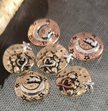 These artisan cat and moon two‑hole beads are perfect for celestial jewelry. Each bead displays mixed‑metal accents of copper, brass, and silver with motifs including crescent moons, stars, and heart shapes. Use them as focal beads in multi‑strand bracelets or pendants for handmade necklaces. Their playful yet spiritual design makes them ideal for pet lover keepsakes, boho, or mystical jewelry collections.