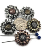 Bring artisan flair to your designs with these sunflower focal beads. Made with non‑tarnish finishes in antique silver, copper, and brass, they’re durable and long‑lasting. Their finely detailed petals and bold central texture make them ideal as pendants or necklace focals. Perfect for boho, rustic, or statement artisan jewelry celebrating florals and natural inspiration.