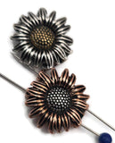 Designed for artisan jewelry makers, these sunflower beads feature exquisite petal detail and textured centers. Finished in copper, brass, and silver, they have a protective coating that resists tarnishing and ensures lasting beauty. With two alignment holes, they work naturally as focal beads or pendants in necklaces. Perfect for floral‑inspired artisan, bohemian, or rustic jewelry collections.
