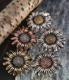 Add a lasting floral statement to your jewelry with these sunflower beads. Each piece showcases realistic petal work and textured centers, finished in non‑tarnish silver, brass, or copper tones. Ideal as focals for necklace pendants or chokers, they combine durability with artisan quality. Perfect supplies for rustic, boho, or artisan floral jewelry collections that emphasize timeless, natural style.